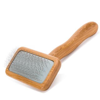 A wooden pet grooming slicker brush with metal bristles and a rectangular head, ideal for detangling and removing loose fur while caring for your Cavoodle. The handle is smooth and ergonomically designed for comfortable use.